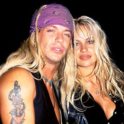 Brett Michaels in a purple bandana with Pamela Anderson