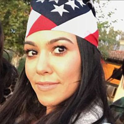 Kourtney Kardashian rocks an American flag bandana.