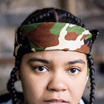 Young M.A in a camo bandana