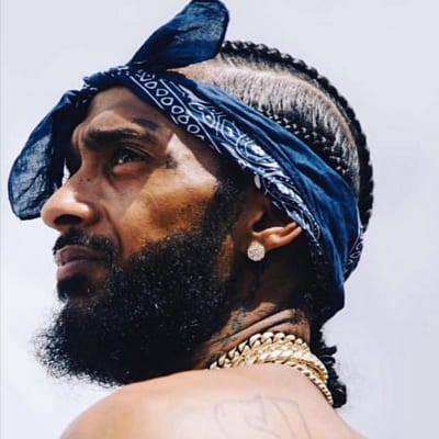 A blue bandana can also create a soulful look like for rapper Nipsey Hussle. RIP